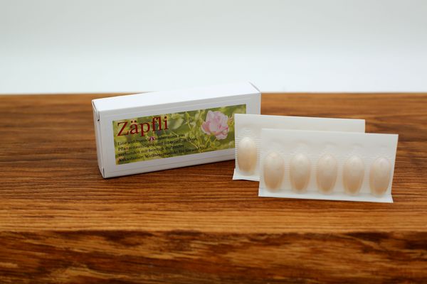 Zäpfli Zäpfchen Packung Holzplatte
